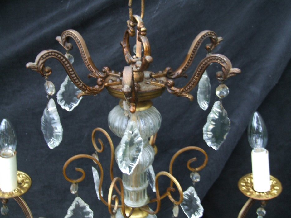 Circa 1900 A 6 arm patinated Brass and Crystal Chandelier 